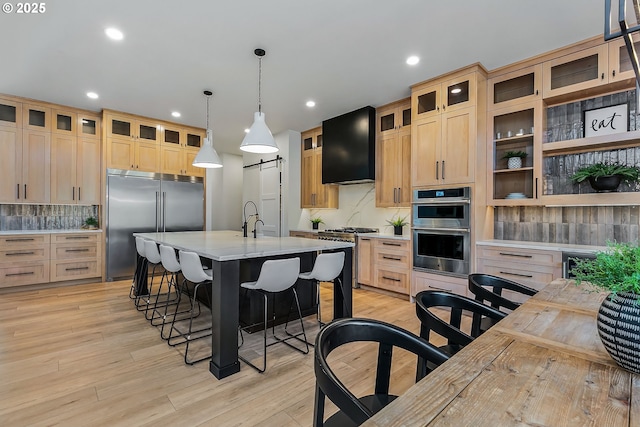 19550 Buck Canyon Rd, Bend, OR 97702 - kitchen featuring recessed lighting, decorative backsplash, a kitchen breakfast bar, and stainless steel appliances