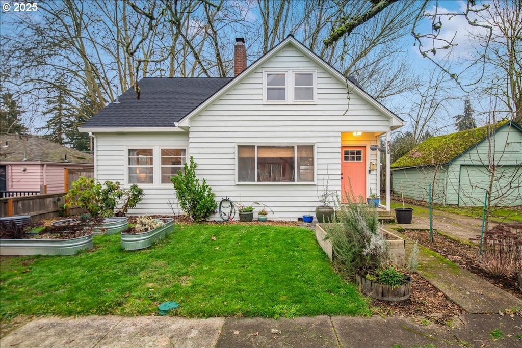 back of house with a lawn