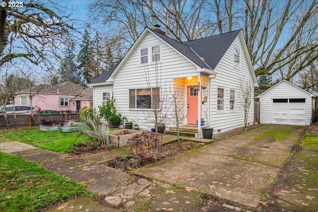 bungalow-style house featuring an outbuilding and a garage