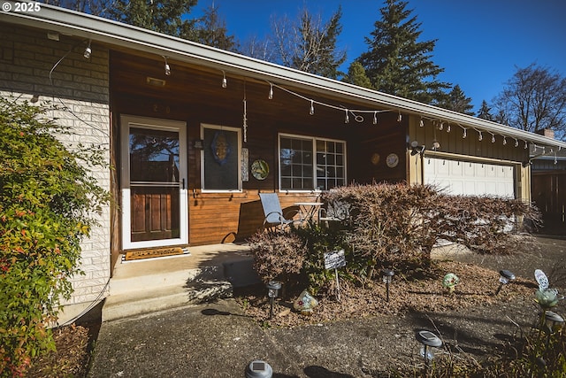 view of front of house featuring a garage and a porch