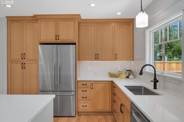 4072 NE 24th Ave, Portland, OR 97212 - kitchen featuring stainless steel appliances, a sink, recessed lighting, backsplash, and hanging light fixtures