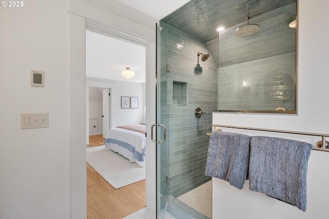 4072 NE 24th Ave, Portland, OR 97212 - bathroom featuring a shower stall, wood finished floors, and ensuite bath