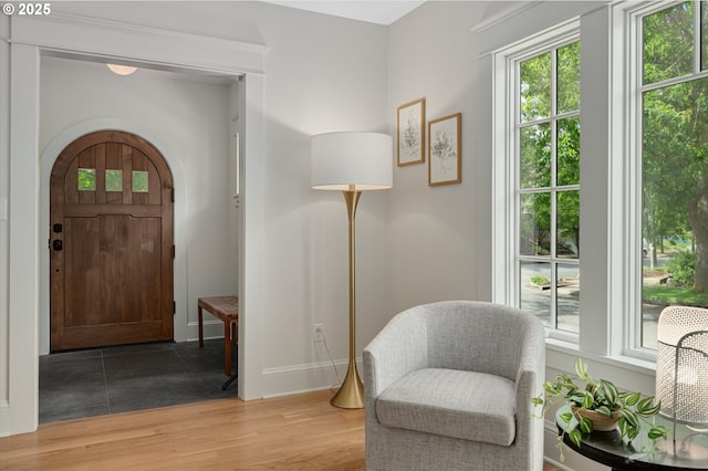 4072 NE 24th Ave, Portland, OR 97212 - foyer entrance featuring baseboards, light wood-type flooring, and arched walkways
