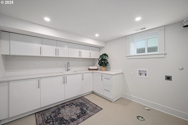 4072 NE 24th Ave, Portland, OR 97212 - laundry area featuring electric dryer hookup, washer hookup, recessed lighting, baseboards, and cabinet space