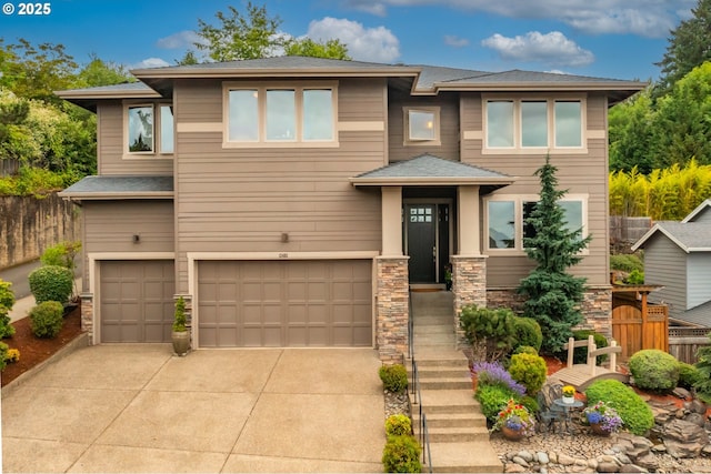 12483 SW Autumn View St, Tigard, OR 97224 - prairie-style home featuring driveway, a garage, stone siding, and a shingled roof