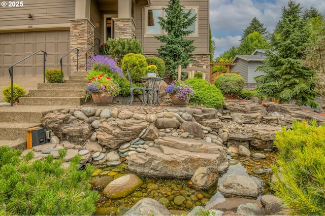 12483 SW Autumn View St, Tigard, OR 97224 - view of yard with a garden pond and a garage