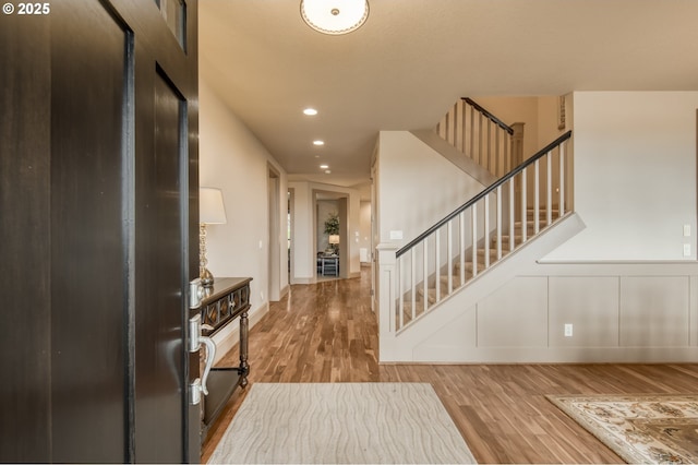 12483 SW Autumn View St, Tigard, OR 97224 - entryway featuring wood finished floors, stairway, recessed lighting, and wainscoting