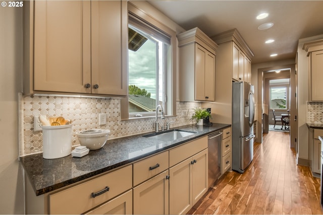 12483 SW Autumn View St, Tigard, OR 97224 - kitchen featuring stainless steel appliances, light wood-type flooring, recessed lighting, decorative backsplash, and plenty of natural light