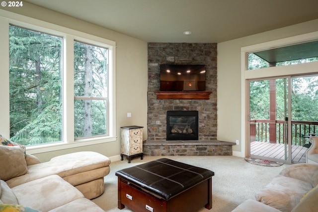 carpeted living room featuring a fireplace