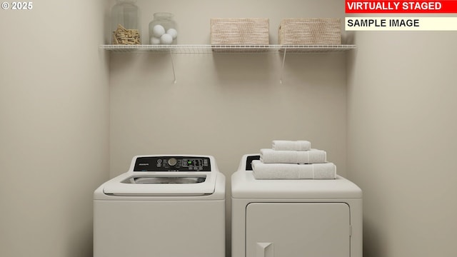 laundry room with washer and dryer and laundry area