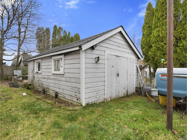 view of outdoor structure with a lawn