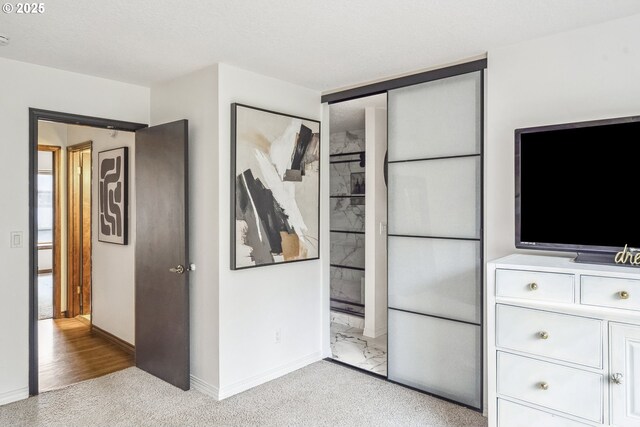 carpeted bedroom with a textured ceiling