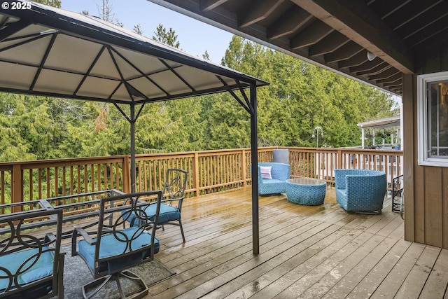 wooden deck featuring a gazebo