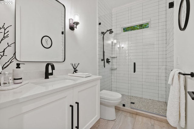 bathroom featuring toilet, an enclosed shower, vanity, and crown molding