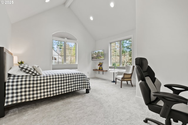 carpeted bedroom with high vaulted ceiling and beam ceiling