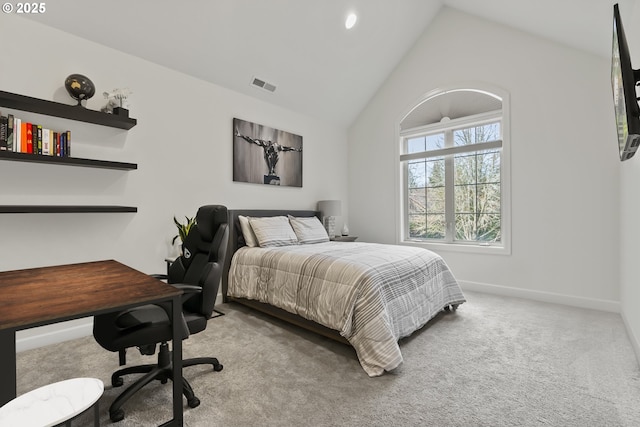 carpeted bedroom with lofted ceiling