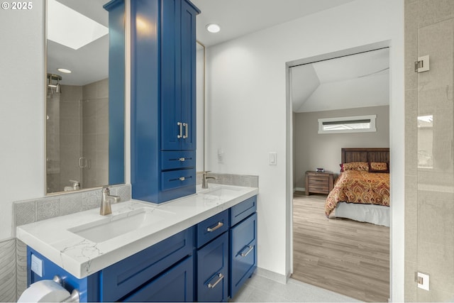 full bathroom featuring ensuite bath, a stall shower, double vanity, and recessed lighting