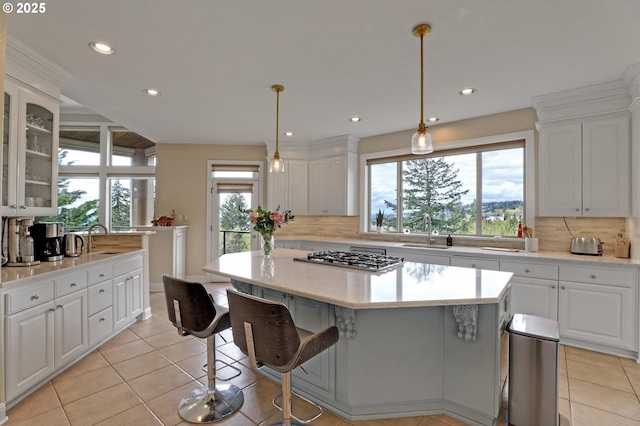 8333 NW Hazeltine St, Portland, OR 97229 - kitchen featuring a sink, stainless steel gas cooktop, light tile patterned floors, and recessed lighting