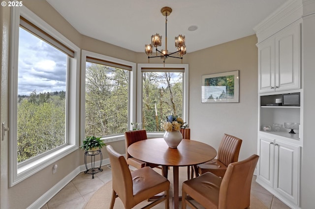 8333 NW Hazeltine St, Portland, OR 97229 - dining room with light tile patterned floors, a chandelier, and baseboards