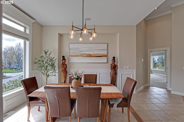 8333 NW Hazeltine St, Portland, OR 97229 - dining space with plenty of natural light, light tile patterned floors, a chandelier, and crown molding