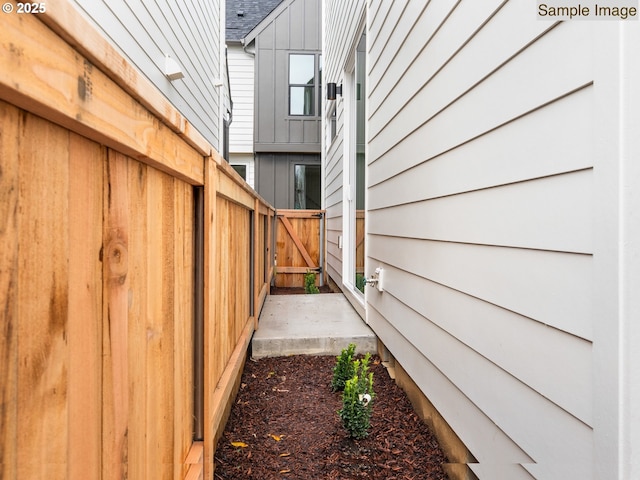 view of home's exterior with fence