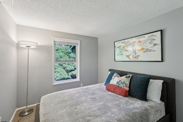7915 SW Fanno Creek Dr Unit 1, Portland, OR 97224 - carpeted bedroom with baseboards and a textured ceiling