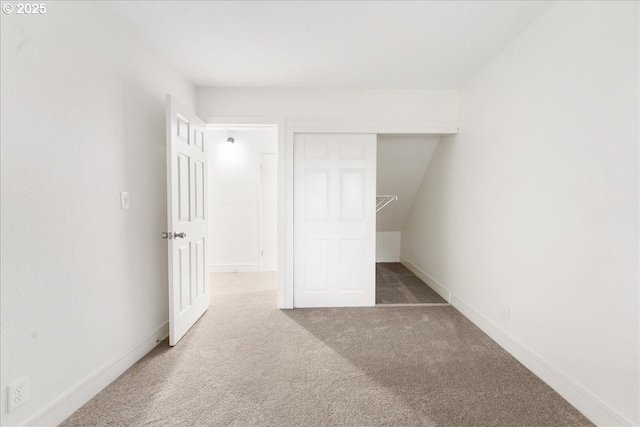 unfurnished bedroom with carpet floors and a closet