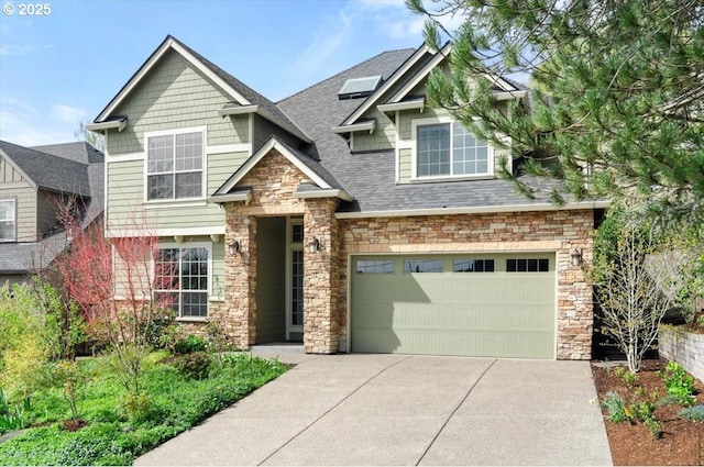 craftsman house with driveway, stone siding, a shingled roof, and a garage