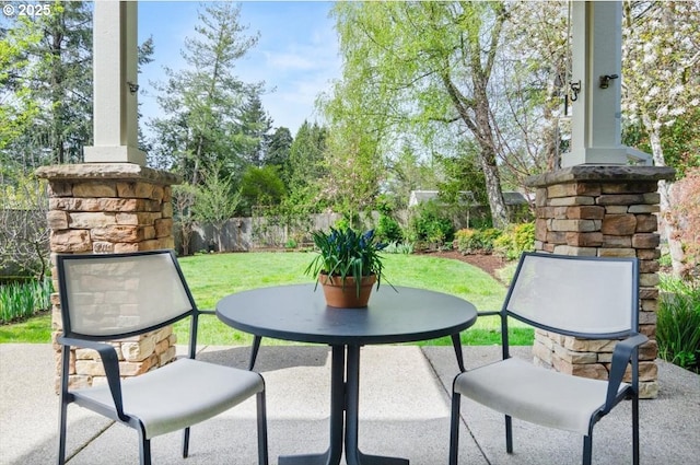view of patio / terrace featuring fence