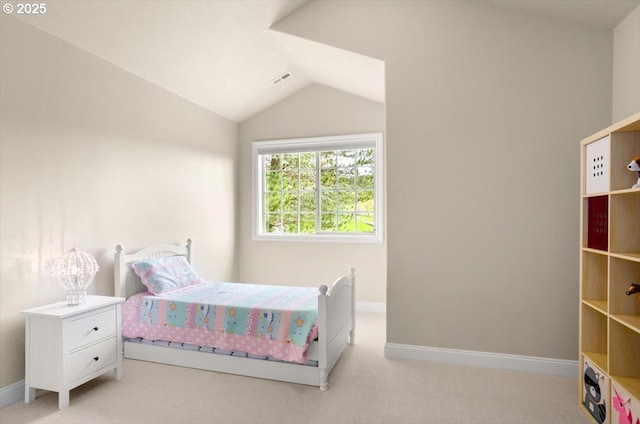 bedroom with carpet floors, visible vents, lofted ceiling, and baseboards