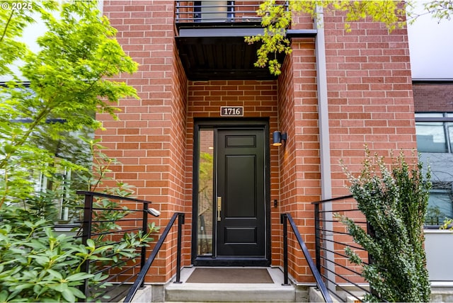 1716 NW Riverscape St, Portland, OR 97209 - view of exterior entry featuring brick siding