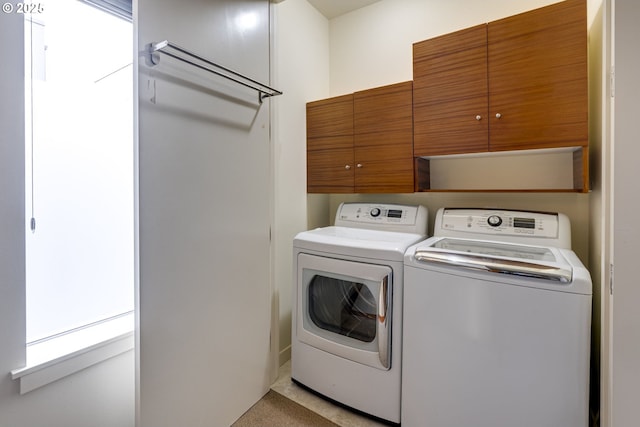 1716 NW Riverscape St, Portland, OR 97209 - laundry area featuring cabinet space and independent washer and dryer