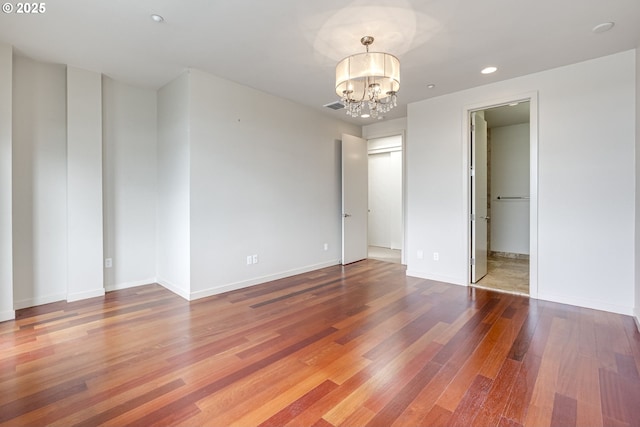 1716 NW Riverscape St, Portland, OR 97209 - unfurnished bedroom featuring visible vents, recessed lighting, a chandelier, wood finished floors, and baseboards