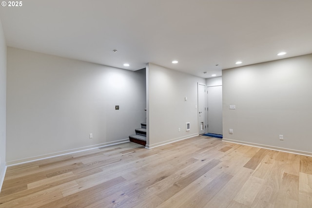 1716 NW Riverscape St, Portland, OR 97209 - finished below grade area with recessed lighting, stairs, light wood-type flooring, and baseboards