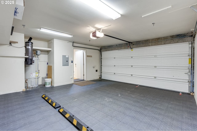 1716 NW Riverscape St, Portland, OR 97209 - garage featuring a garage door opener, electric panel, and water heater