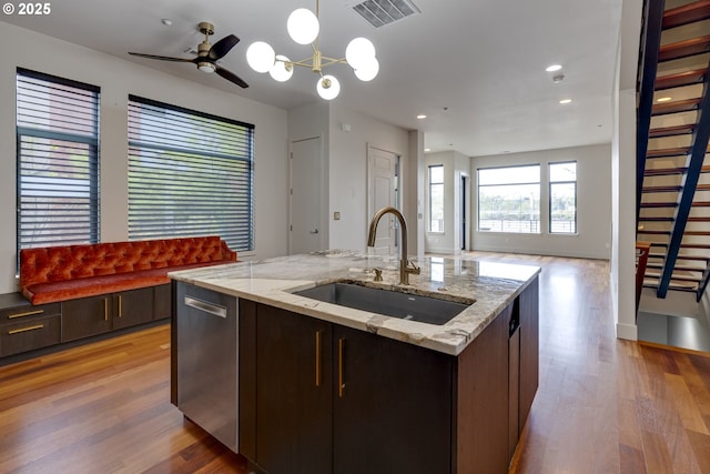 1716 NW Riverscape St, Portland, OR 97209 - kitchen featuring visible vents, dishwasher, a sink, open floor plan, and light wood-style floors