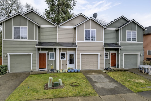 view of front of property with an attached garage, a shingled roof, driveway, and board and batten siding