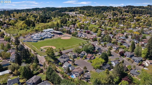 aerial view featuring a residential view and a view of trees