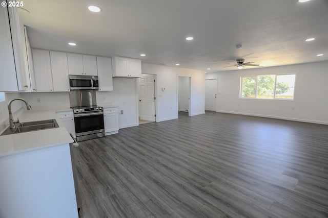 180 SE Darrell Ave, Winston, OR 97496 - kitchen featuring appliances with stainless steel finishes, a ceiling fan, dark wood-style floors, recessed lighting, and open floor plan