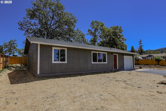 180 SE Darrell Ave, Winston, OR 97496 - ranch-style house featuring a fenced backyard, driveway, and an attached garage