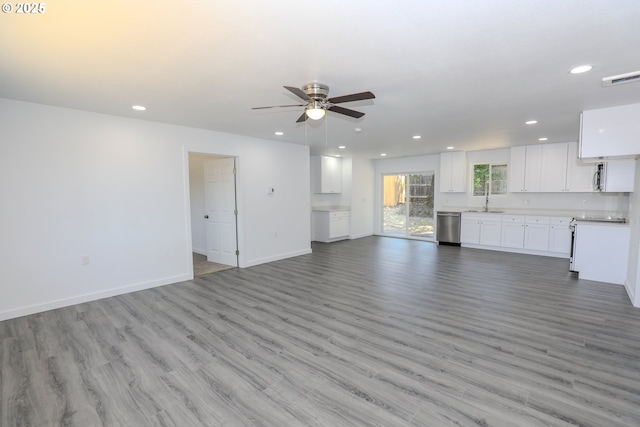 180 SE Darrell Ave, Winston, OR 97496 - unfurnished living room featuring a ceiling fan, recessed lighting, and light wood-style floors