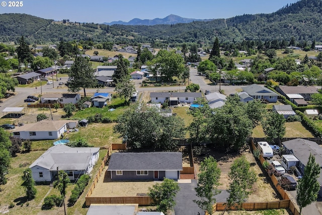 180 SE Darrell Ave, Winston, OR 97496 - aerial perspective of suburban area with a mountain backdrop
