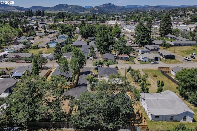 180 SE Darrell Ave, Winston, OR 97496 - aerial perspective of suburban area featuring a mountain backdrop