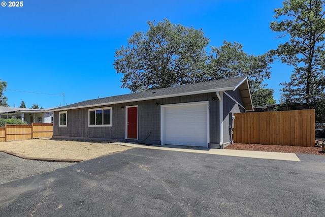 180 SE Darrell Ave, Winston, OR 97496 - ranch-style home featuring a garage and a shingled roof