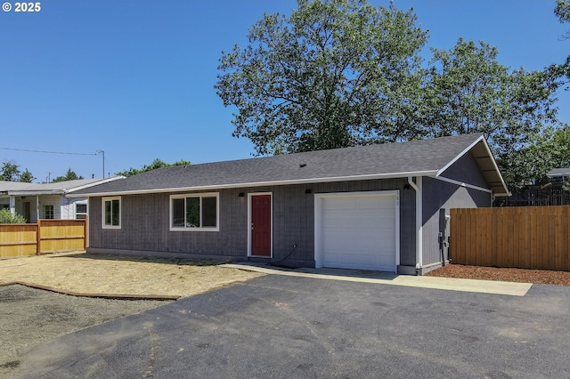 180 SE Darrell Ave, Winston, OR 97496 - ranch-style house with a garage and roof with shingles