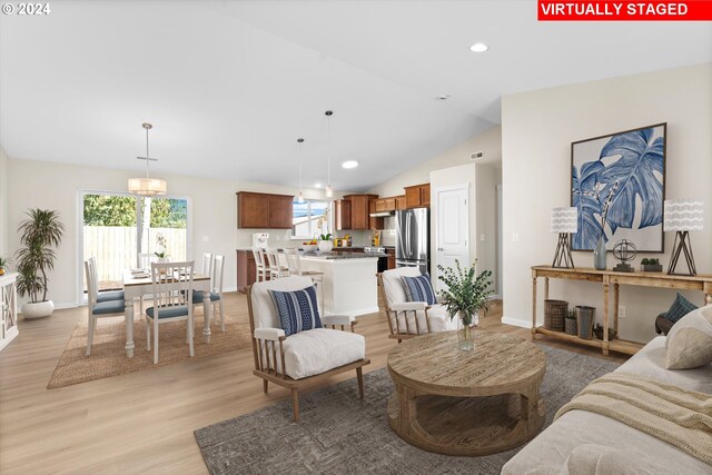 11480 Fern Way, Nehalem, OR 97131 - living area with light wood finished floors, plenty of natural light, lofted ceiling, baseboards, and recessed lighting