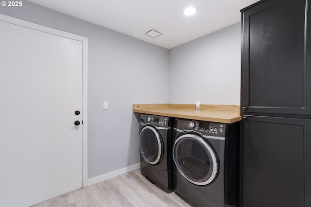 washroom featuring laundry area, baseboards, light wood-style flooring, separate washer and dryer, and recessed lighting