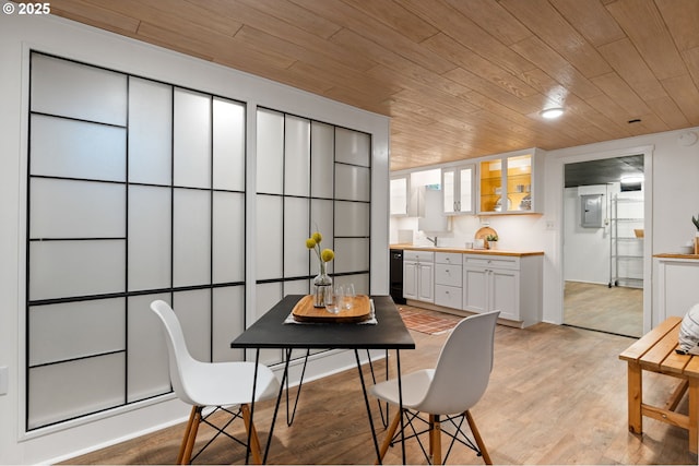 dining area with wood ceiling and light wood-style floors