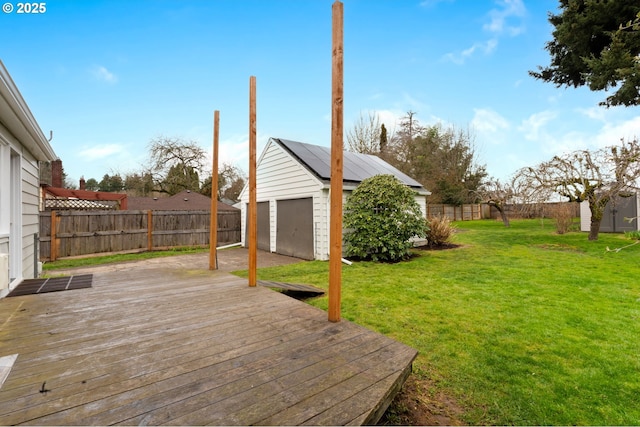 deck featuring a yard, a shed, an outbuilding, and a fenced backyard