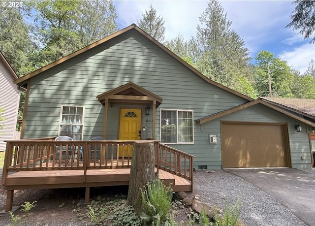 65121 E Lupine Dr, Rhododendron, OR 97049 - view of front facade featuring an attached garage, asphalt driveway, crawl space, and a deck
